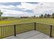 Expansive backyard view from the deck, highlighting the lush green meadow and scenic landscape at 46531 Sundance Trl, Parker, CO 80138