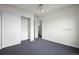 Bedroom featuring a closet, ceiling fan, and neutral carpet for a comfortable and versatile space at 46531 Sundance Trl, Parker, CO 80138