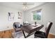Cozy bedroom with hardwood floors featuring a ceiling fan, a desk, and comfortable seating, perfect for a home office at 46531 Sundance Trl, Parker, CO 80138