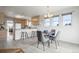 Bright dining area with natural light, comfortable seating, and convenient access to the kitchen at 46531 Sundance Trl, Parker, CO 80138