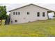 Exterior side view of a house with stairs leading to the backyard and deck at 46531 Sundance Trl, Parker, CO 80138