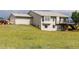 Exterior view of home featuring walkout basement and scenic backyard at 46531 Sundance Trl, Parker, CO 80138