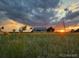 Exterior view of house at sunset at 46531 Sundance Trl, Parker, CO 80138