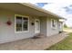 Inviting front porch with decorative flower baskets and a well-maintained stone pathway at 46531 Sundance Trl, Parker, CO 80138