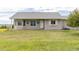 Ranch home with bay window, grey paint, flower boxes and flower baskets at 46531 Sundance Trl, Parker, CO 80138