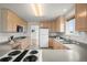 Functional kitchen featuring ample cabinet space, modern appliances, and a double stainless steel sink at 46531 Sundance Trl, Parker, CO 80138