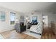 Comfortable living room with hardwood floors, fireplace, and serene outdoor views at 46531 Sundance Trl, Parker, CO 80138