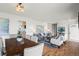 Open-concept space with seamless flow between the dining and living areas, bathed in natural light with elegant decor at 46531 Sundance Trl, Parker, CO 80138