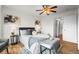 Comfortable main bedroom with hardwood floors, a ceiling fan, and a closet providing a relaxing and organized space at 46531 Sundance Trl, Parker, CO 80138