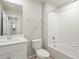 Modern bathroom with tub-shower combination, white vanity, stylish faucet, and updated fixtures at 22340 E 8Th Ave, Aurora, CO 80018