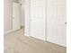 Spacious bedroom with neutral carpet, closet with sliding doors, and entrance to the hallway at 22340 E 8Th Ave, Aurora, CO 80018