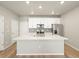 Contemporary kitchen featuring white cabinets, stainless steel appliances, and a quartz island at 22340 E 8Th Ave, Aurora, CO 80018
