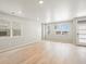 Airy living room features natural light, hardwood floors, and neutral paint at 22340 E 8Th Ave, Aurora, CO 80018