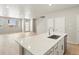 Open floor plan with kitchen island and light filled Living Room featuring modern finishes at 22340 E 8Th Ave, Aurora, CO 80018