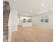 Bright open-concept living room features hardwood floors and seamless flow into a modern kitchen at 22340 E 8Th Ave, Aurora, CO 80018