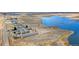 Stunning aerial view of the community with a pond, fields and the property visible, surrounded by natural beauty at 5425 County Road 32 # 27, Mead, CO 80504