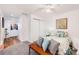 Comfortable bedroom featuring a closet and a doorway with hardwood flooring at 5425 County Road 32 # 27, Mead, CO 80504