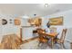 Cozy dining area with wood table and chairs next to an open kitchen at 5425 County Road 32 # 27, Mead, CO 80504