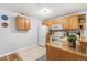 Functional kitchen featuring white appliances and wood cabinets with granite countertops at 5425 County Road 32 # 27, Mead, CO 80504