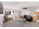 Comfortable living room with plush carpet, ceiling fan, and lots of natural light at 5425 County Road 32 # 27, Mead, CO 80504