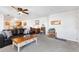 Spacious living room featuring a ceiling fan, office space and open floor plan at 5425 County Road 32 # 27, Mead, CO 80504