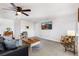 Bright living room with ceiling fan, TV and warm decorations at 5425 County Road 32 # 27, Mead, CO 80504