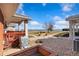 Relaxing outdoor patio with beautiful landscaping and scenic lake views at 5425 County Road 32 # 27, Mead, CO 80504