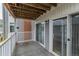 Nice back porch area with sliding doors and outdoor lighting at 3436 S Locust St # D, Denver, CO 80222