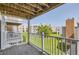 Balcony view overlooking lush green lawn and mature trees at 3436 S Locust St # D, Denver, CO 80222