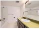 Standard bathroom features a vanity with a round sink and a shower over the tub at 3436 S Locust St # D, Denver, CO 80222