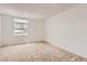 Neutral bedroom featuring carpet flooring, a window and closet at 3436 S Locust St # D, Denver, CO 80222