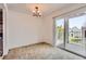 Dining area with balcony access and a hanging light fixture at 3436 S Locust St # D, Denver, CO 80222