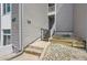 Exterior steps of gray house, featuring address number at 3436 S Locust St # D, Denver, CO 80222