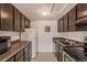 Kitchen with a full suite of appliances and cabinetry at 3436 S Locust St # D, Denver, CO 80222