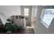 Stairwell with lots of natural light and plant decor at 14860 Guernsey Dr, Mead, CO 80542