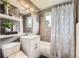 Bathroom featuring tile, a bathtub, a shower curtain, and decorations at 6046 Vrain St, Arvada, CO 80003