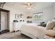Bright bedroom featuring a ceiling fan, a window, and carpeted floors at 6046 Vrain St, Arvada, CO 80003