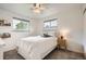 Cozy bedroom with a window view, bedside table, and plush carpeting at 6046 Vrain St, Arvada, CO 80003