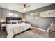 Bedroom featuring carpet, a ceiling fan, and multiple windows at 6046 Vrain St, Arvada, CO 80003