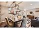 Open dining area next to an updated kitchen and modern living room, great for entertaining and relaxation at 6046 Vrain St, Arvada, CO 80003