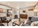 Modern living space with hardwood floors, neutral walls, and an open layout to the updated kitchen at 6046 Vrain St, Arvada, CO 80003