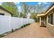 Spacious brick patio with privacy fence, perfect for outdoor entertaining and relaxation at 7895 W 67Th Ave, Arvada, CO 80004