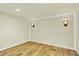 This bedroom features wood floors and modern sconce lighting at 7895 W 67Th Ave, Arvada, CO 80004