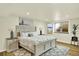 Cozy bedroom features neutral decor, a decorative headboard, and plush bedding at 7895 W 67Th Ave, Arvada, CO 80004