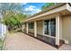 Back patio featuring a large paved area and covered space at 7895 W 67Th Ave, Arvada, CO 80004