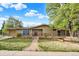 Inviting home exterior with landscaped front yard and brick pathway leading to the entrance at 7895 W 67Th Ave, Arvada, CO 80004