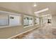Extended hallway with large windows and skylights, offering an abundance of natural light at 7895 W 67Th Ave, Arvada, CO 80004