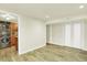 Laundry room with stackable washer/dryer next to utility sink and adjacent closet at 7895 W 67Th Ave, Arvada, CO 80004
