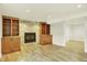 Comfortable living area with a fireplace and built-in shelving, offering a cozy retreat at 7895 W 67Th Ave, Arvada, CO 80004