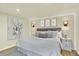 Serene main bedroom with soft neutral tones, decorative lighting, and stylish decor at 7895 W 67Th Ave, Arvada, CO 80004